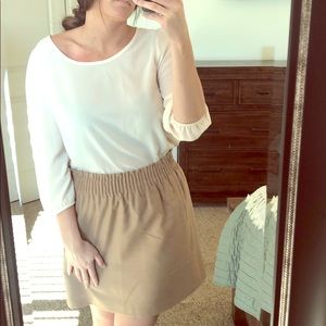 Simple, yet not.  Cream blouse w buttons down back